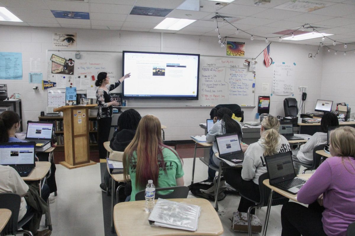 Scott teaching her English class
